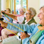 Large,Group,Of,Happy,Enthusiastic,Elderly,Ladies,Exercising,In,A